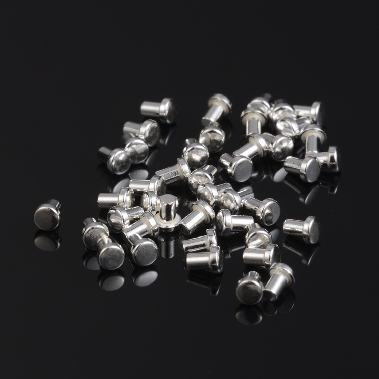 Solid silver-alloy electrical contact rivets