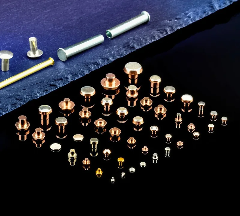 Electrical contact rivets in several silver-alloy material systems